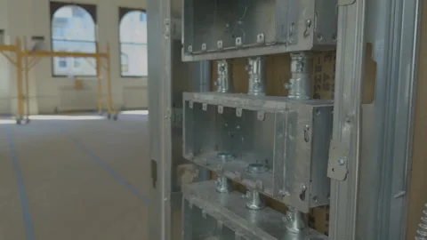 Electrical Junction Boxes and Conduits Installed in Metal Stud Wall Construction Stock Footage 337439866
