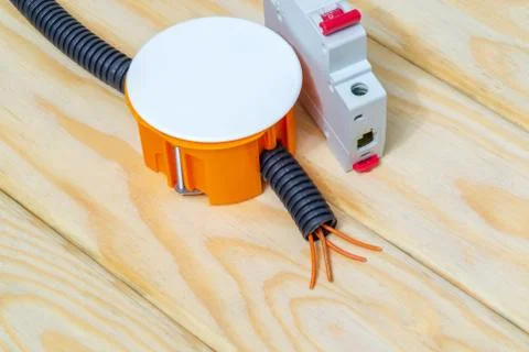 Electrical junction orange box with wires usually used in the electric instal Stock Photos