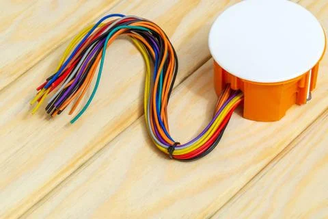 Electrical junction orange box with wires usually used in the electric instal Stock Photos