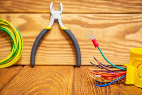 Electrical junction yellow box with cable wire used in the electric installation Stock Photos