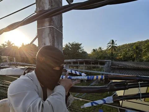Electrical lineman worker using insulation tube on twisted aerial bundle. Stock Photos