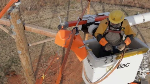Electrical Lineman Working On Power lines on Utility Pole Stock Footage 124245214