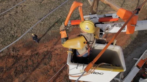 Electrical Lineman Working On Power lines on Utility Pole Stock Footage 124245246