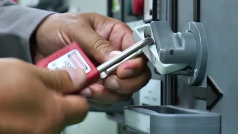 Electrical lockout system applied before maintenance work highlights safe work p 库存影片 335966772