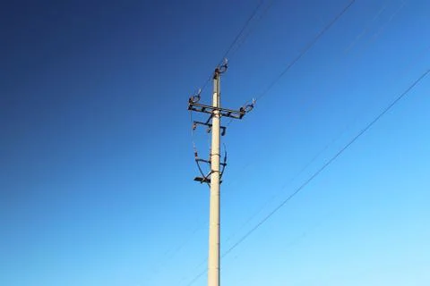 Electrical network of high voltage. Transportation of electricity through the Stock Photos