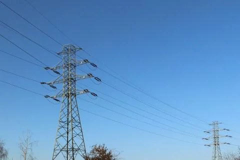 Electrical network of high voltage. Transportation of electricity through the Stock Photos