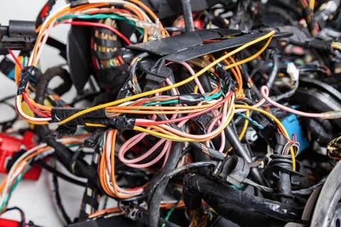 Electrical network of multi-colored wires: yellow, red and green, rewound wit Stock Photos