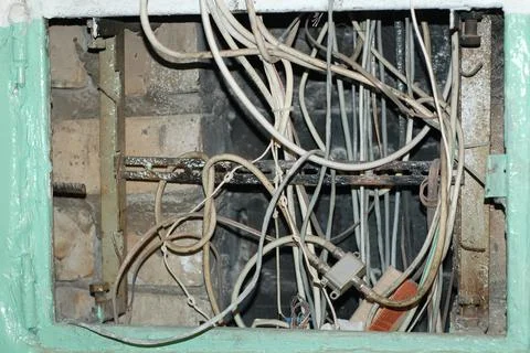 Electrical networks and security concept - electrical panel with intertwined Фото