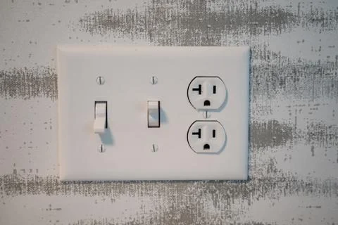 Electrical outlet socket with light switches and grounded North American plug Stock Photos