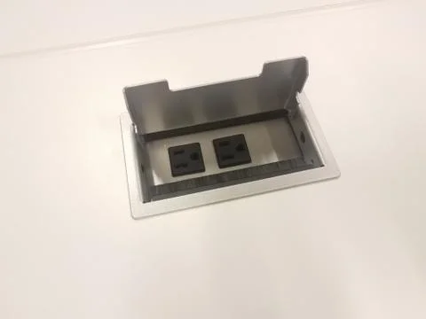 Electrical outlet on white table or surface Stock Photos