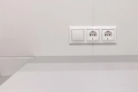 Electrical outlets and switch on the wall Stock Photos
