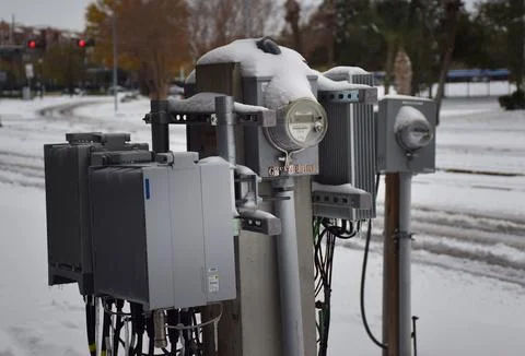 Electrical Panel along with electric meter covered in Snow Stock Photos