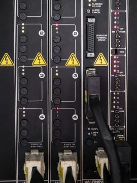 Electrical panel at a assembly line factory. Controls and switches. Stock Photos