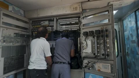Electrical panel inside a train car. Electricians performing maintenance Stock Footage 335878180