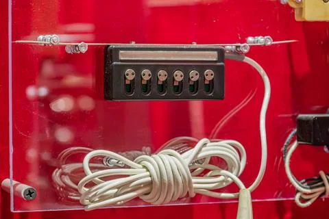 Electrical Panel with Metal Terminals and Cables on Red Background Stock Photos