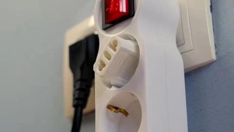 Electrical plug adapter in a splitter socket Stock Footage 247055181