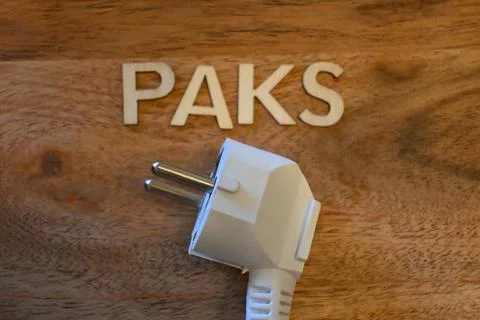 Electrical plug and Paks sign representing energy shortage Stock Photos