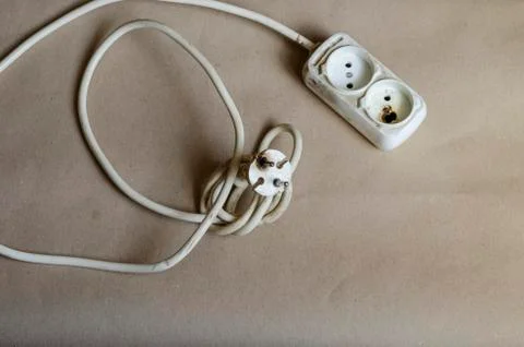Electrical plug condition ,outlet after shock on brown background. Foto stock