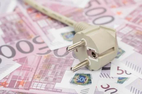 Electrical plug on the money Stock Photos