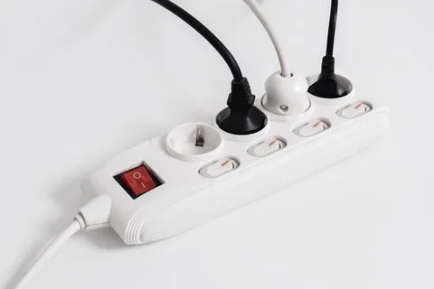 Electrical plug in outlet socket at home isolated on white background Stock Photos