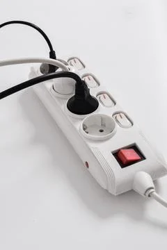 Electrical plug in outlet socket at home isolated on white background Stock Photos