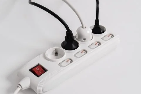 Electrical plug in outlet socket at home isolated on white background Stock Photos