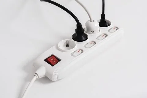 Electrical plug in outlet socket at home isolated on white background Stock Photos