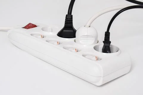 Electrical plug in outlet socket at home isolated on white background Stock Photos