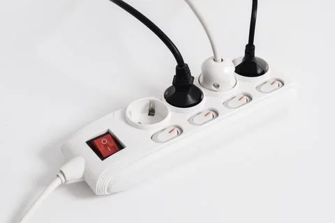 Electrical plug in outlet socket at home isolated on white background Stock Photos