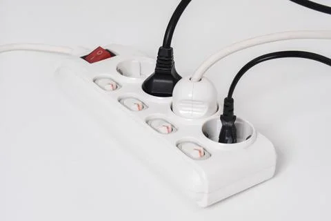 Electrical plug in outlet socket at home isolated on white background Stock Photos