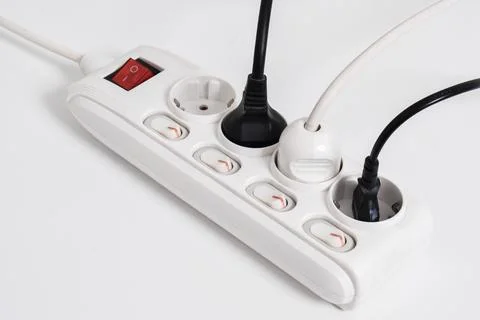 Electrical plug in outlet socket at home isolated on white background Stock Photos