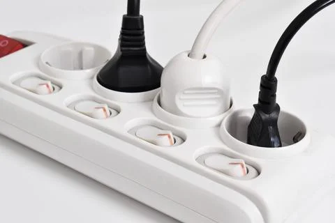 Electrical plug in outlet socket at home isolated on white background Stock Photos