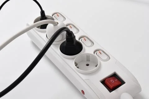 Electrical plug in outlet socket at home isolated on white background Stock Photos