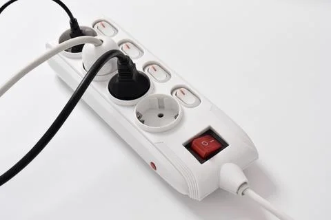 Electrical plug in outlet socket at home isolated on white background Stock Photos