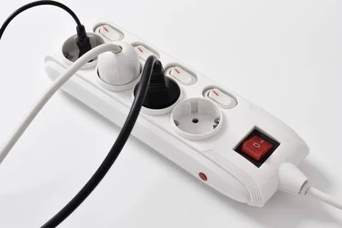 Electrical plug in outlet socket at home isolated on white background Stock Photos