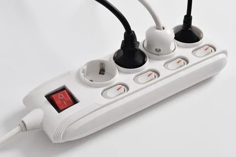 Electrical plug in outlet socket at home isolated on white background Stock Photos