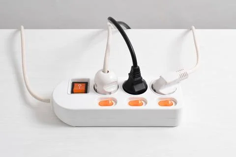 Electrical plug in outlet socket at home isolated on white background, Outlet Stock Photos