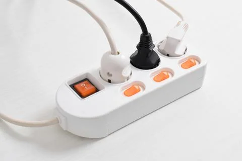 Electrical plug in outlet socket at home isolated on white background, Outlet Stock Photos