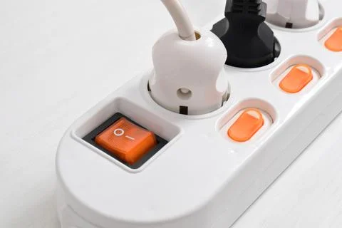 Electrical plug in outlet socket at home isolated on white background, Outlet Stock Photos