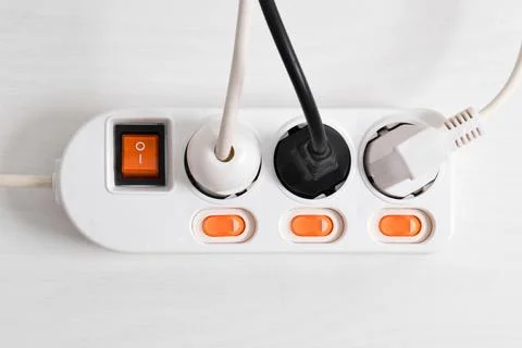 Electrical plug in outlet socket at home isolated on white background, Outlet Stock Photos