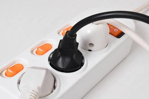 Electrical plug in outlet socket at home isolated on white background, Outlet Stock Photos