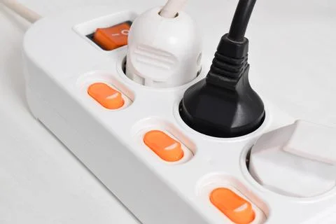 Electrical plug in outlet socket at home isolated on white background, Outlet Stock Photos