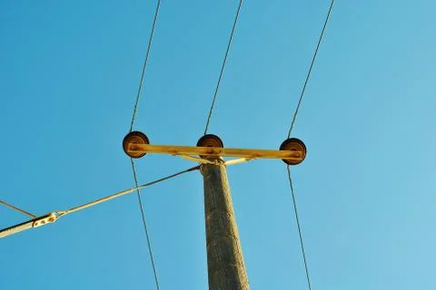 Electrical pole with blue sky background. Stock Photos