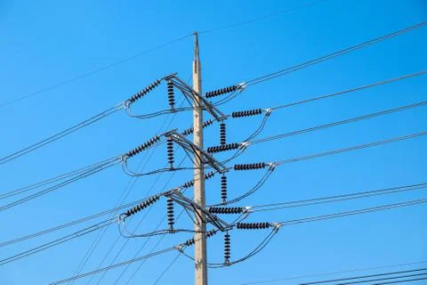 Electrical poles of high voltage Stock Photos