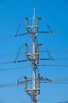 Electrical poles of high voltage Stock Photos