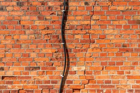 Electrical power cable wiring on old brick wall Electrical power cable wir... Stock Photos
