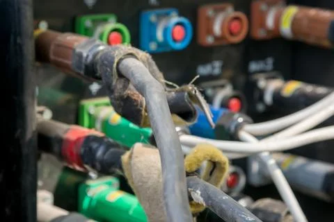 Electrical power cables connected to a temporary outdoors distribution statio Stock Photos
