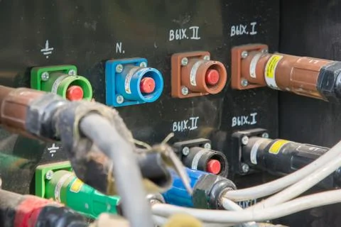 Electrical power cables connected to a temporary outdoors distribution statio Stock Photos