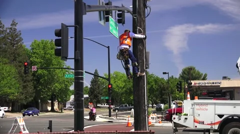 Electrical Power Co., climbing down pole Stock Footage 50662914