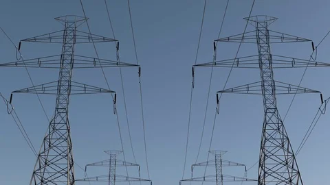 Electrical power lines and pylons under sky. energy conservation conception Stock Footage 75337177